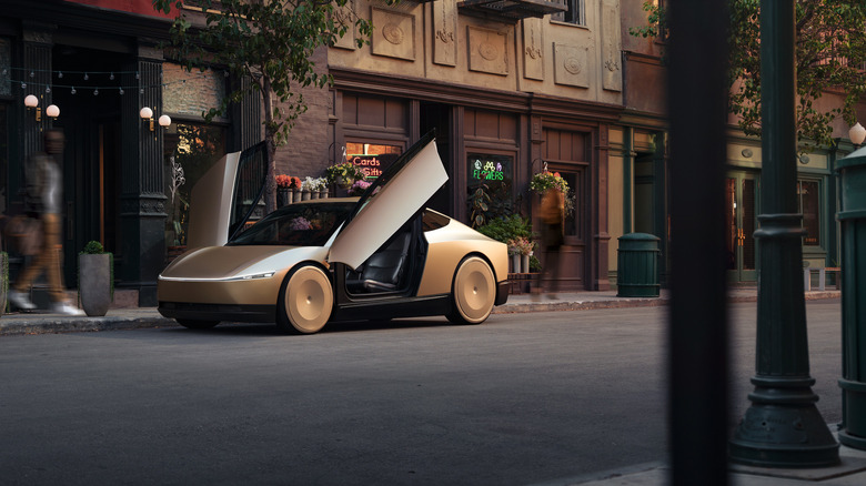 Tesla Cybercab parked in front of a florist, with the Tesla's doors open.